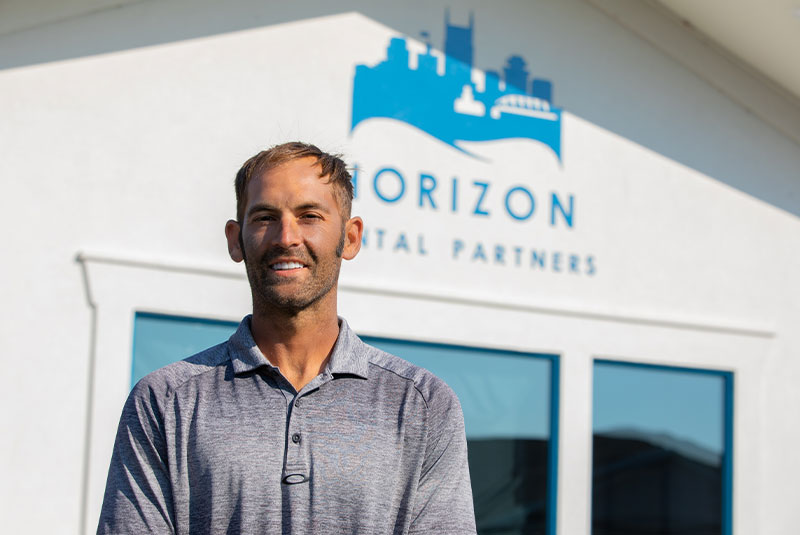 Patient smiling after service from Horizon dental partners